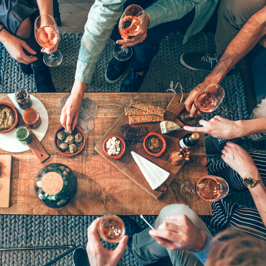 Cheese-charcuterie-board-with-people-eating